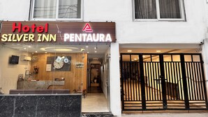 A hotel named 'Hotel Silver Inn' with a reception area and a wooden interior. - Hotel Silver Inn by PENTAURA (Rishikesh)