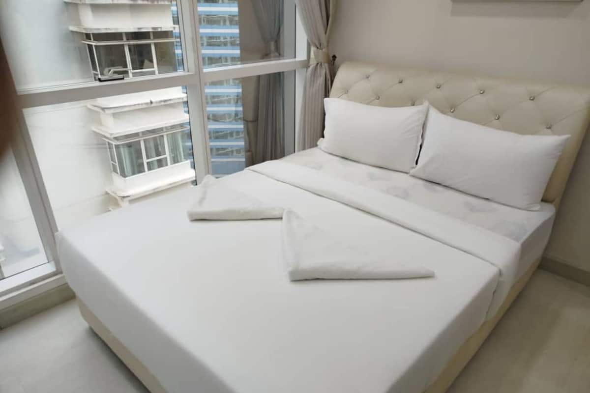 Appartement Familial, non-fumeurs, vue ville | Coffres-forts dans les chambres, fer et planche à repasser