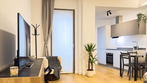 A modern apartment with a living area, a dining space, and a kitchen. - VivimiHome - Navigli Design Loft con Terrazzo (Milano)