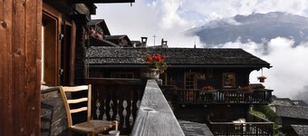 3-room apartment for 4 persons in the old village : dining-room with wood stove and TV - 1 room with