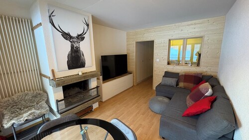 Studio for 2-4 people: Living room with 1 double sofa bed (160x200) and fireplace - kitchen with ove