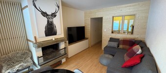 Studio for 2-4 people: Living room with 1 double sofa bed (160x200) and fireplace - kitchen with ove