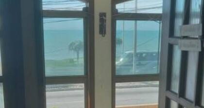 Fully furnished beachfront apartment with ocean views.