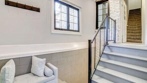 A staircase with a metal railing leading to a landing. - Pet Friendly! Near Casinos & Lake Michigan Beaches (Hammond)