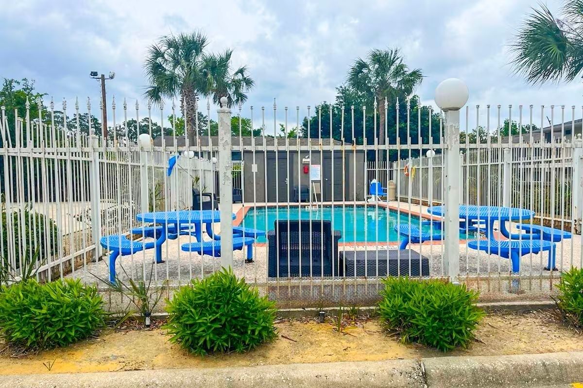 Unwind poolside under palm trees with refreshing afternoon dips.