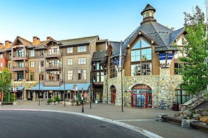 A row of multi-story buildings with a theater, a restaurant, and a spa. - Martis Landing 3 Bedroom Home (Truckee)