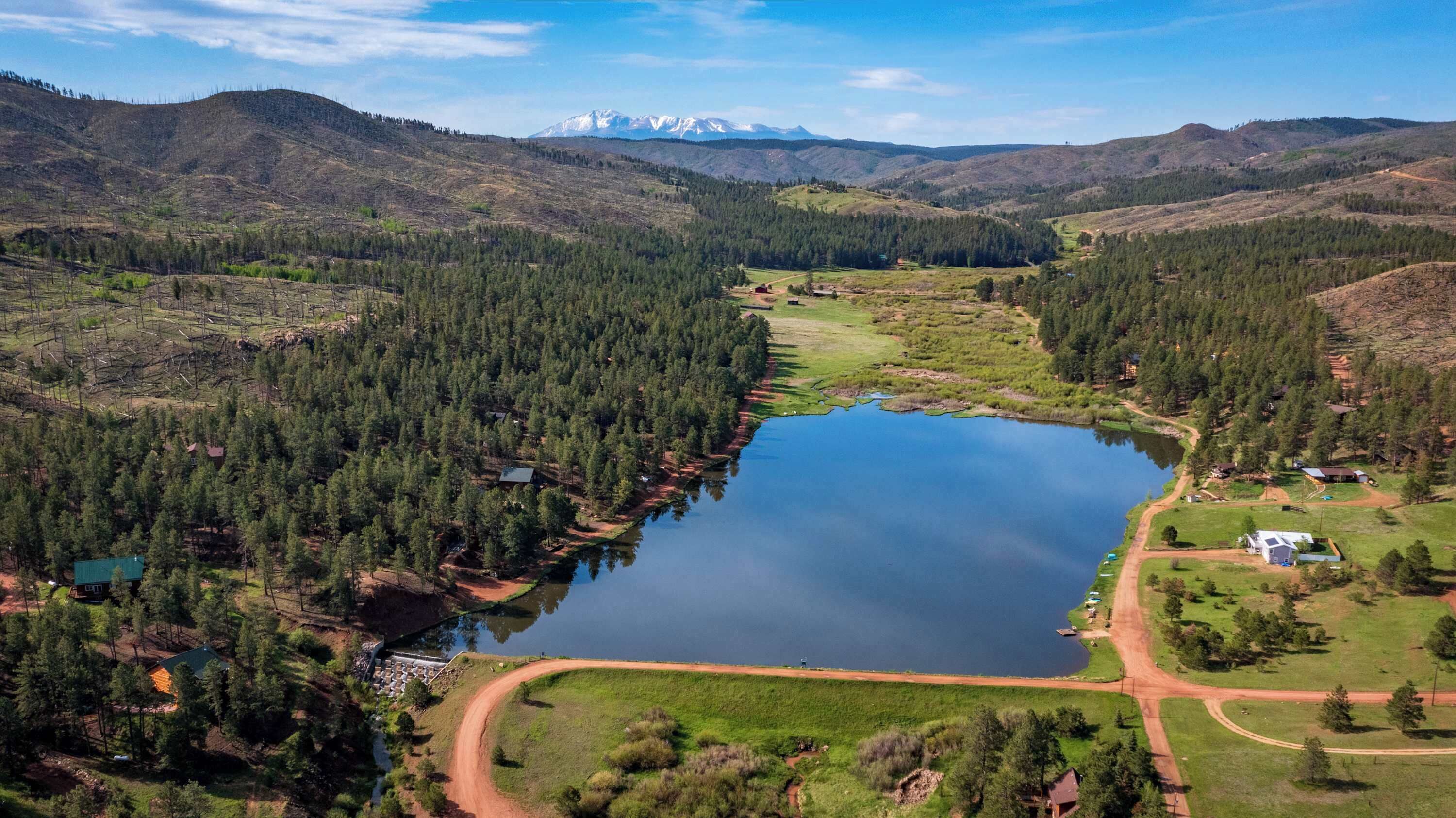 Westcreek Lakes community. Cabin sits just above the lake with long views and open skies.