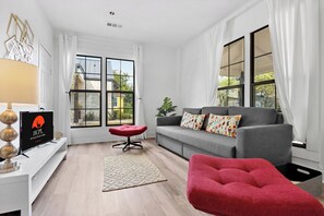 TV, fireplace - Charming Downtown Buda Cottage | Walk to Dining, Shops & Nightlife (Buda)