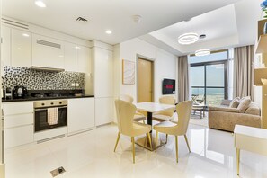 Fridge, microwave, oven, stovetop - Serene 2BR with Canal Views, 7 Mins to Burj Khalifa (Dubai)
