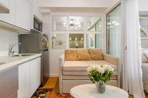 Executive Apartment, Balcony, City View | Living area - Dessa'sCrib Apartment by Azure 1BR (Parañaque)