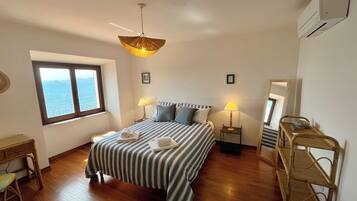 1 bedroom, desk, iron/ironing board, travel crib