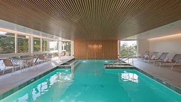 Indoor pool, open 9:00 AM to 11:00 PM, pool umbrellas, pool loungers