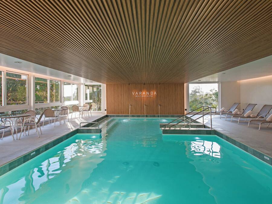 Indoor pool, open 9:00 AM to 11:00 PM, pool umbrellas, sun loungers