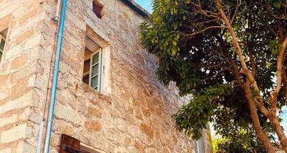 Village house between sea and mountains