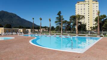 Seasonal outdoor pool, pool umbrellas, pool loungers