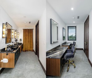 A modern bathroom with a vanity, mirrors, and a shower area. - Spacious 7-bedroom villa in beautiful Leeward Settlement with AC (Leeward)
