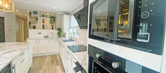 Super spacious modern lodge with large balcony and hot tub.