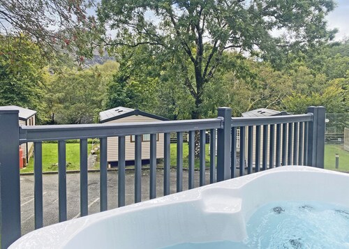 Super spacious modern lodge with large balcony and hot tub.