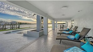 Terrace/patio - NEW! Bayfront Oasis with Pool, Dock & Sunset Views – Minutes to Siesta Key! (Sarasota)