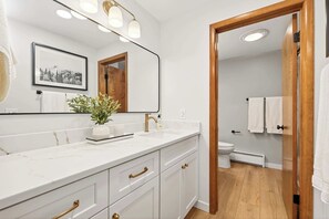 Shower, hair dryer, towels, shampoo