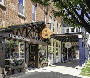 A storefront with a sign for 'Elicottville Coffee Co.' and 'Alpine Bistro.'