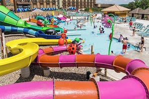 A water park with multiple water slides and pools.