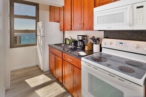 Fridge, microwave, oven, stovetop - 31st Fl Waikiki Banyan | Parking | AC | Partial-Ocean Views (Honolulu)