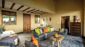 Superior Suite, Balcony, Beach View | Living area | 50-inch TV with cable channels, toys