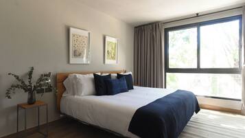 Minibar, desk, laptop workspace, iron/ironing board
