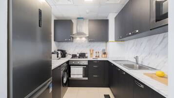 Luxury Apartment, Balcony, City View | Private kitchen | Full-size fridge, microwave, oven, stovetop