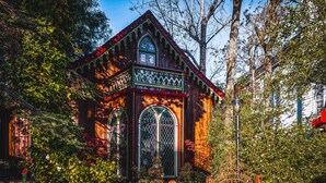 A historic building with a distinctive Gothic Revival architectural style, featuring pointed arches and a steeply pitched roof.