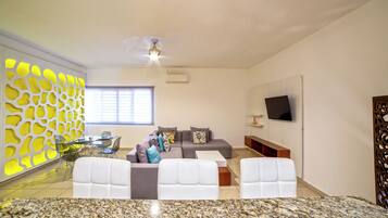 Comfort Apartment | Living area | 50-inch LED TV with digital channels