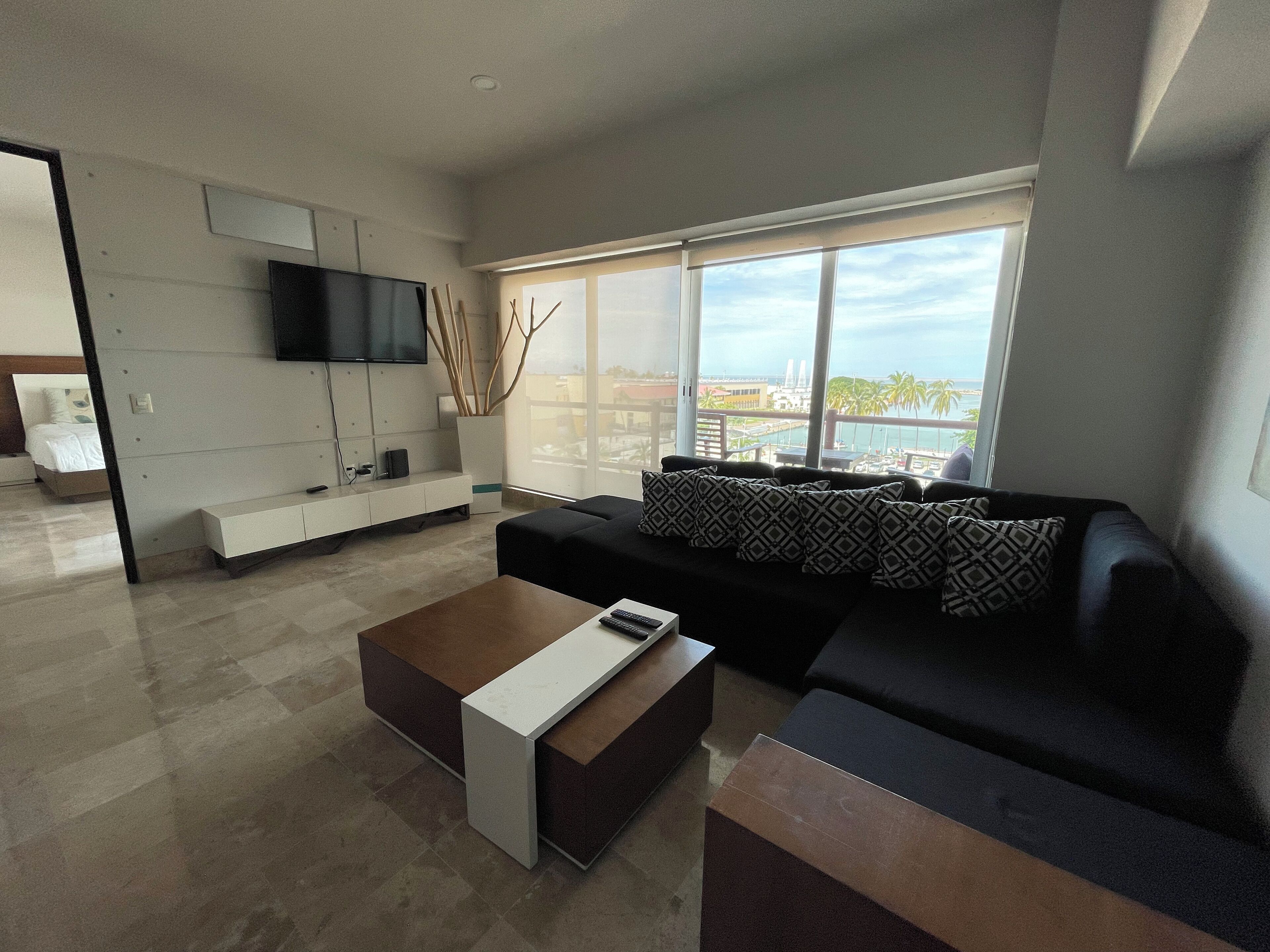 Deluxe Apartment | Living area | 50-inch LED TV with digital channels