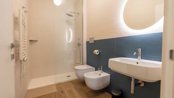 Deluxe Studio, City View | Bathroom | Shower, hair dryer, towels, soap