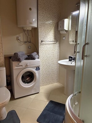 Shower, hair dryer, towels, soap