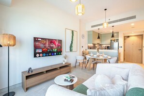 Luxury Apartment, Golf View | Living room | 40-inch Smart TV with digital channels - PVH -  1BR plus Single Bed - Golf Gate (Dubai)