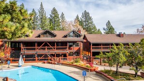A lodge with a pool, surrounded by trees. - 3BR Basecamp for Tahoe Days Done Right (Tahoe Vista)