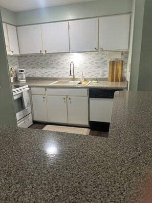 Fridge, microwave, stovetop, dishwasher - A8 Ocean Walk - 1 bed 1 bath beautiful street view, steps to heated pool. (St. Simons Island)