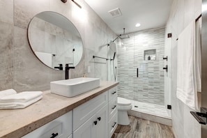 Shower, hair dryer, towels, soap