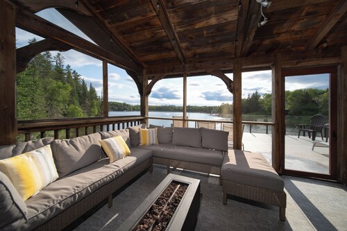 Charming Cottage- lakefront, hot tub, snowmobiling