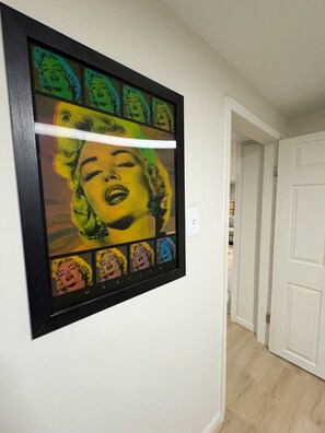 A framed pop art print of Marilyn Monroe on a white wall. - Business-Ready Private Suite 15 minutes to DC Metro Area (Falls Church)