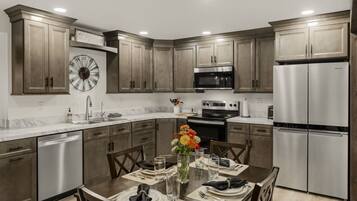 Coffee/tea maker, fridge, microwave, oven
