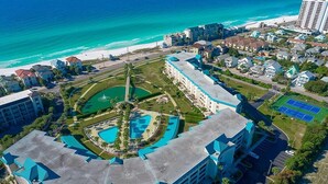 A hotel with a central courtyard, multiple swimming pools, and a beach view. - Amalfi Coast 318b (Miramar Beach)