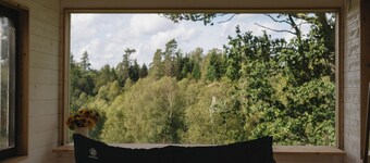 Wake up to flower fields on a cozy countryside farm.