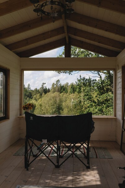 Wake up to flower fields on a cozy countryside farm.