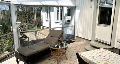 Wake up to flower fields on a cozy countryside farm.