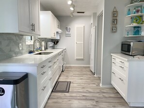 Microwave, oven, stovetop, dishwasher - Stunning Beach House with Heated Pool, Spacious Lanai, Just Steps from the Sand! (Holmes Beach)