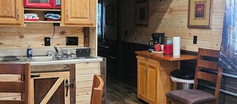 Cabin 1 is a Cozy 2-bedroom cabin outside wonderful Fair Play with AC and heat