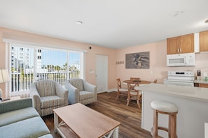 Standard Condo, 1 Bedroom, Courtyard View | Living area | 32-inch flat-screen TV with cable channels