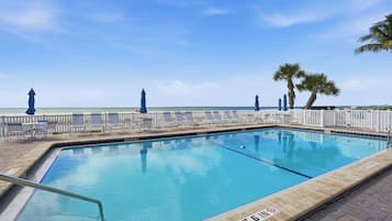 Outdoor pool, pool umbrellas, sun loungers